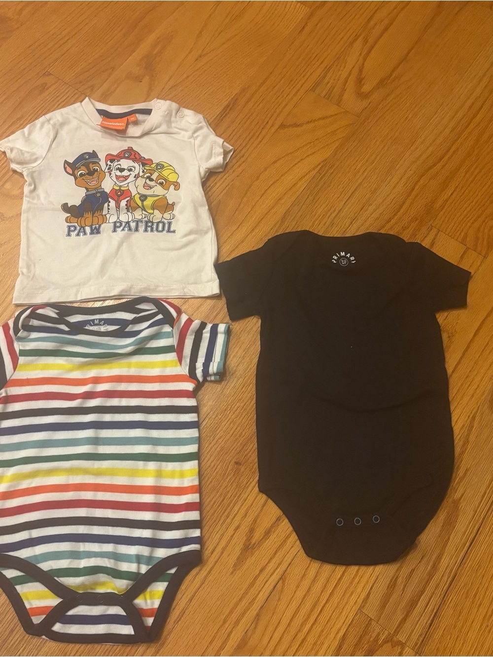Like New!! (Never worn!) 2 Primary onesies (black & stripe) & Paw Patrol Tshirt!